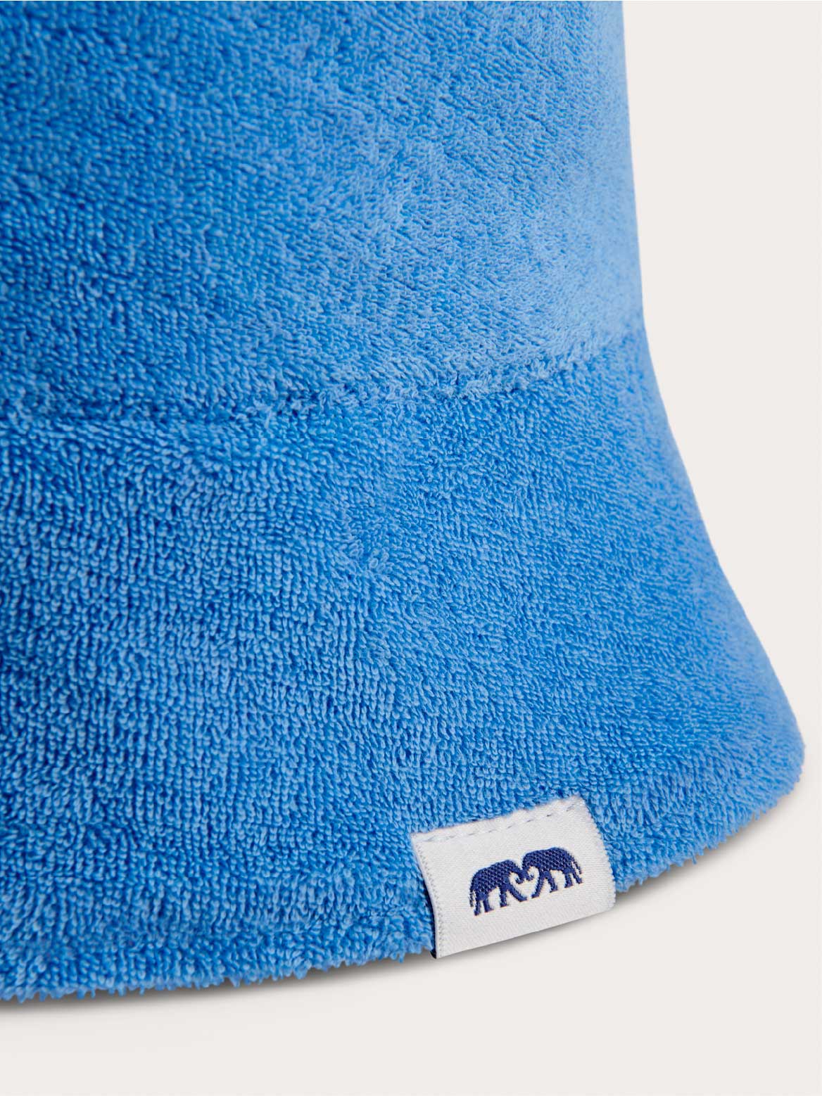 close-up of blue bucket hat with love brand logo.