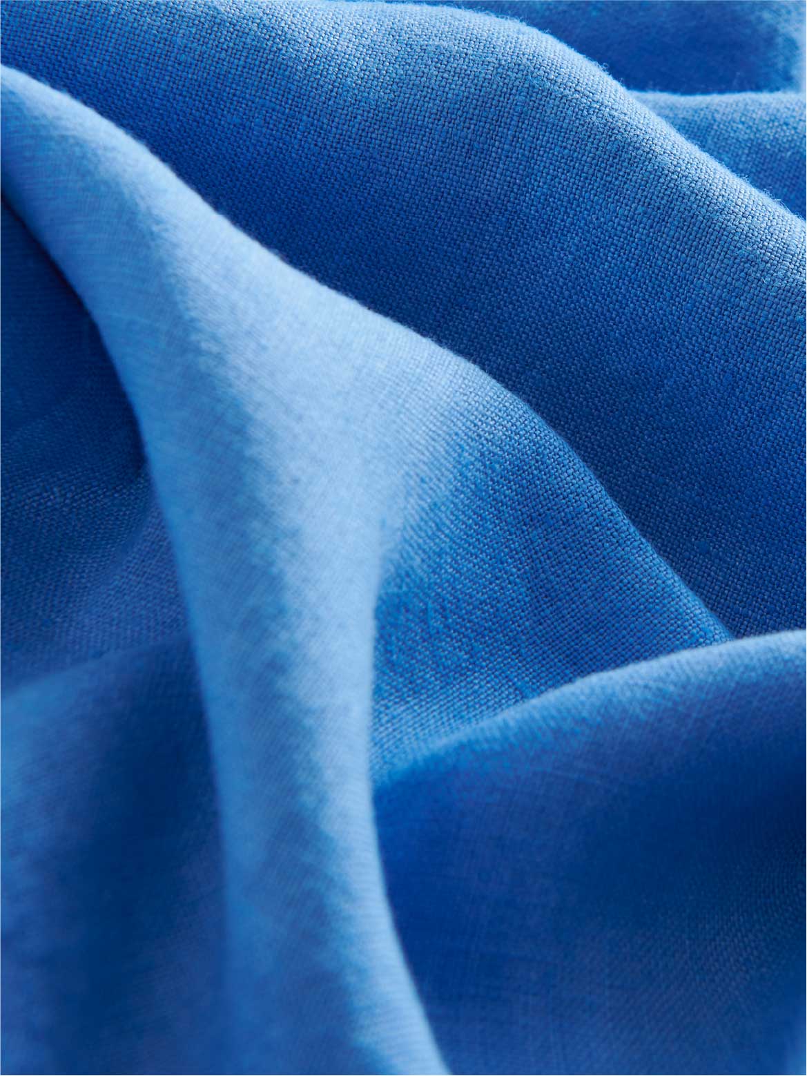 Close-up of blue linen fabric.
