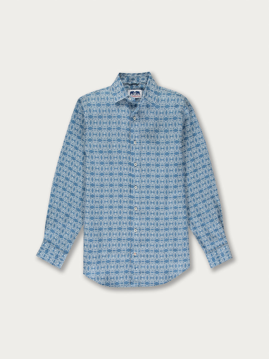 Men's Constant Coral Abaco Linen Shirt showcasing an original coral pattern in white on a sun-beaten blue background, inspired by coral reef transplants.