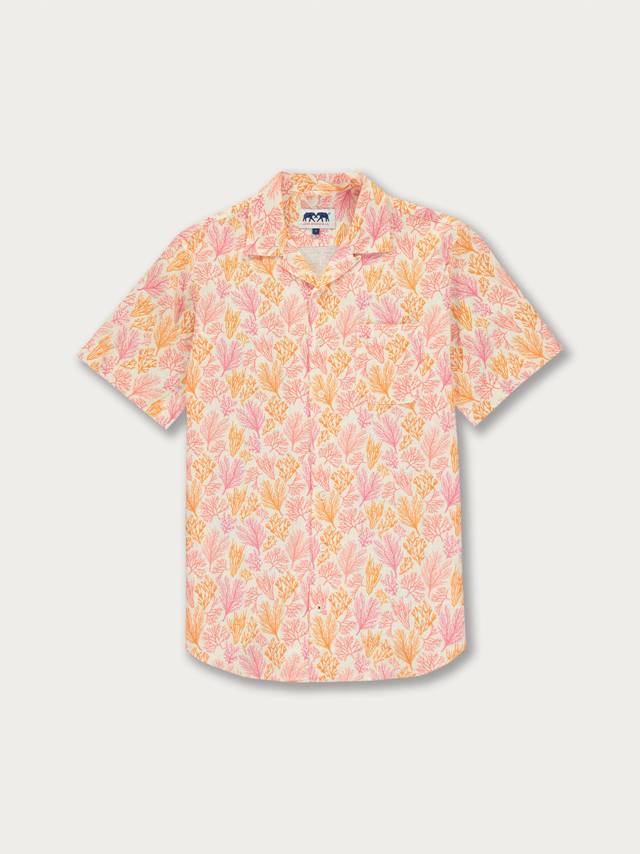 A short-sleeved men's shirt with an orange, pink, and coral geometric coral print.