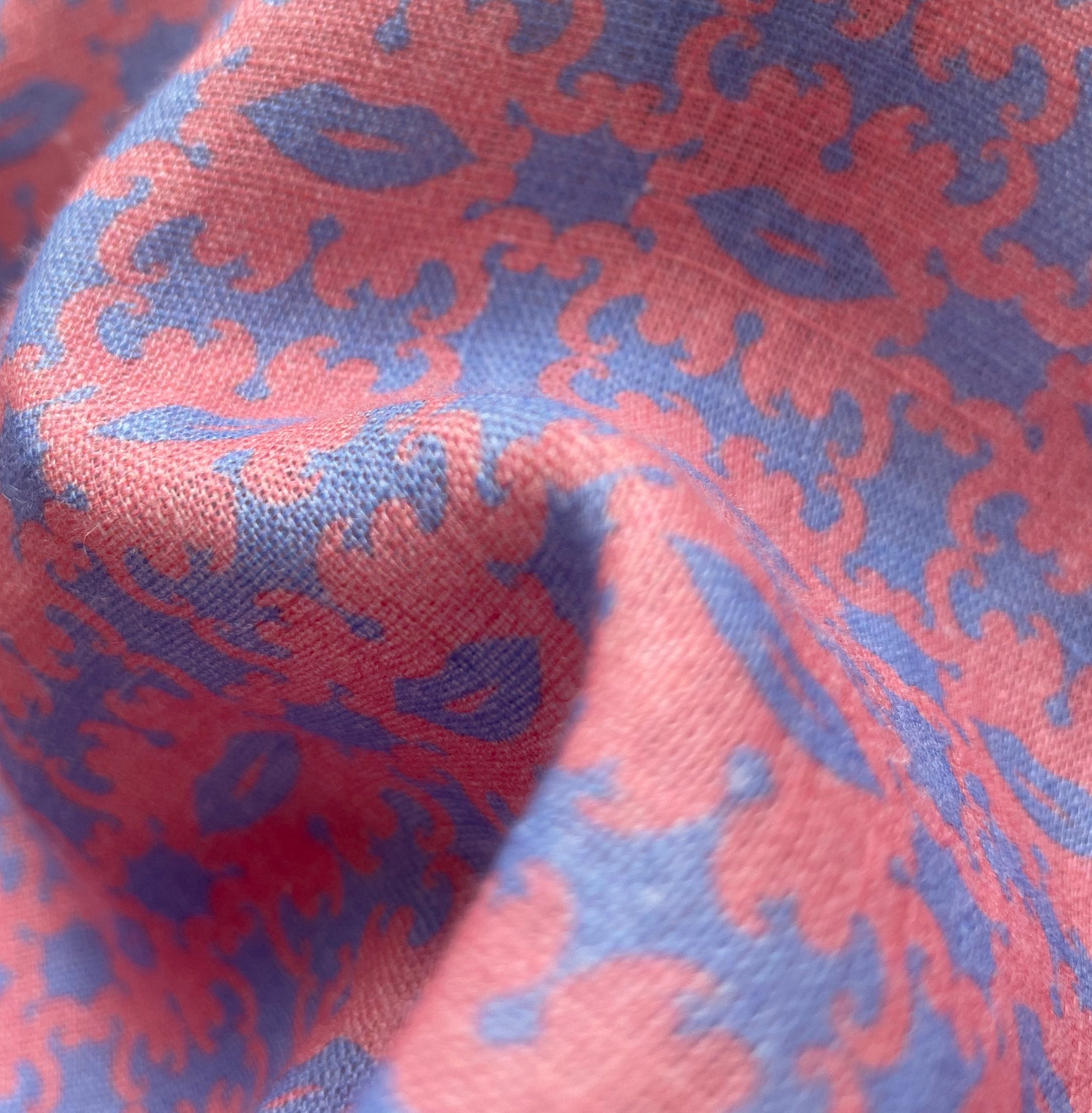 Close-up of the fabric of the Men's Octopus Kiss Manjack Linen Shirt, featuring a vibrant blue and pink octopus and kiss print design.