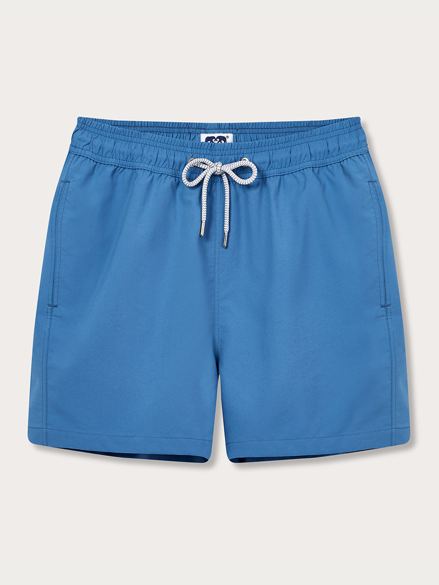 Men's French Blue Staniel Swim Shorts crafted from lightweight, quick-drying 100% recycled fabric. Plain blue swim shorts with a drawstring waist and pockets.