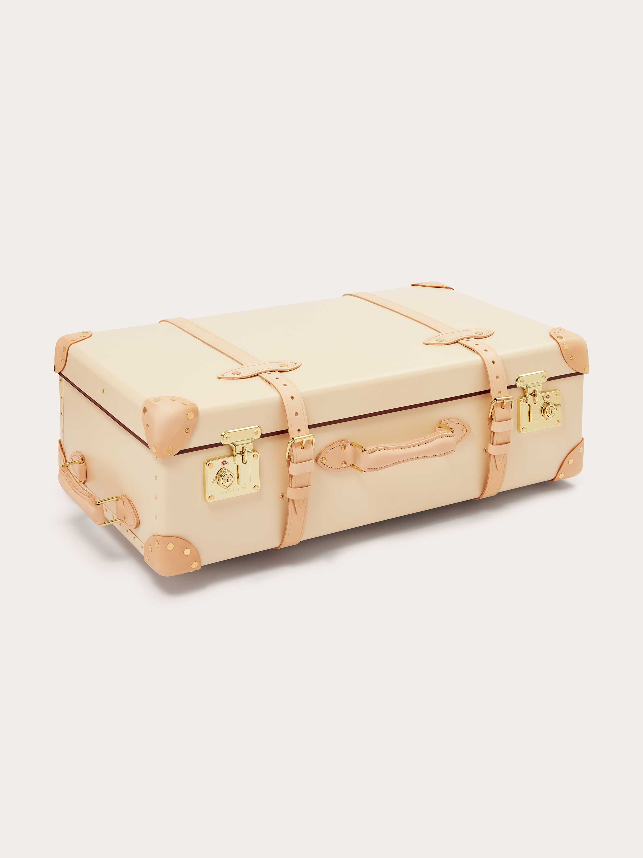 Globe-Trotter Safari 30" Trolley Case by LOVE BRAND & Co. featuring beige leather exterior with tan leather straps and gold hardware.