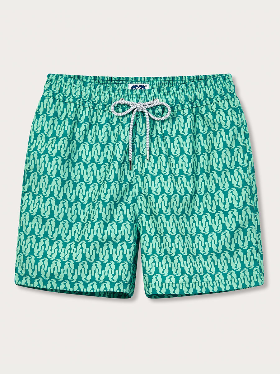 A pair of green and blue geometric patterned men's swim shorts with a drawstring waistband.