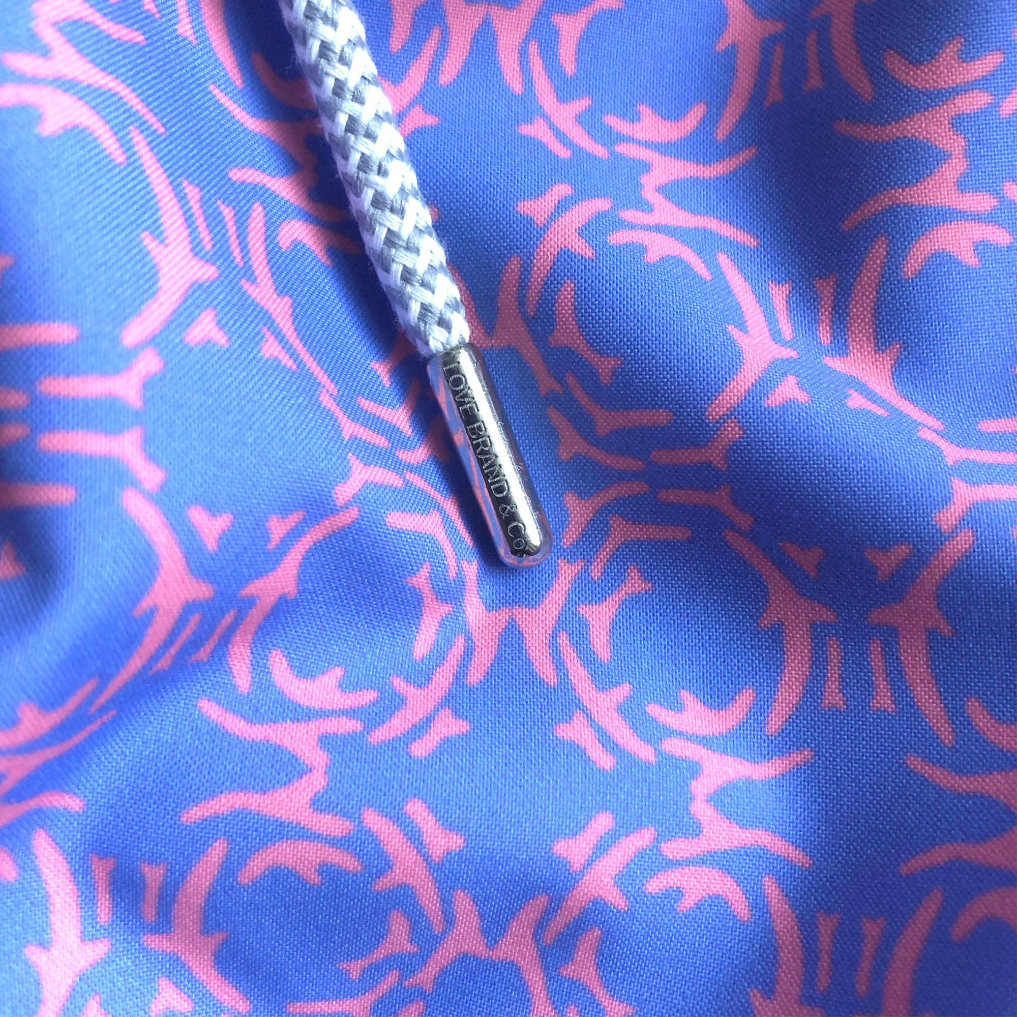 close-up view of purple and blue swim shorts
