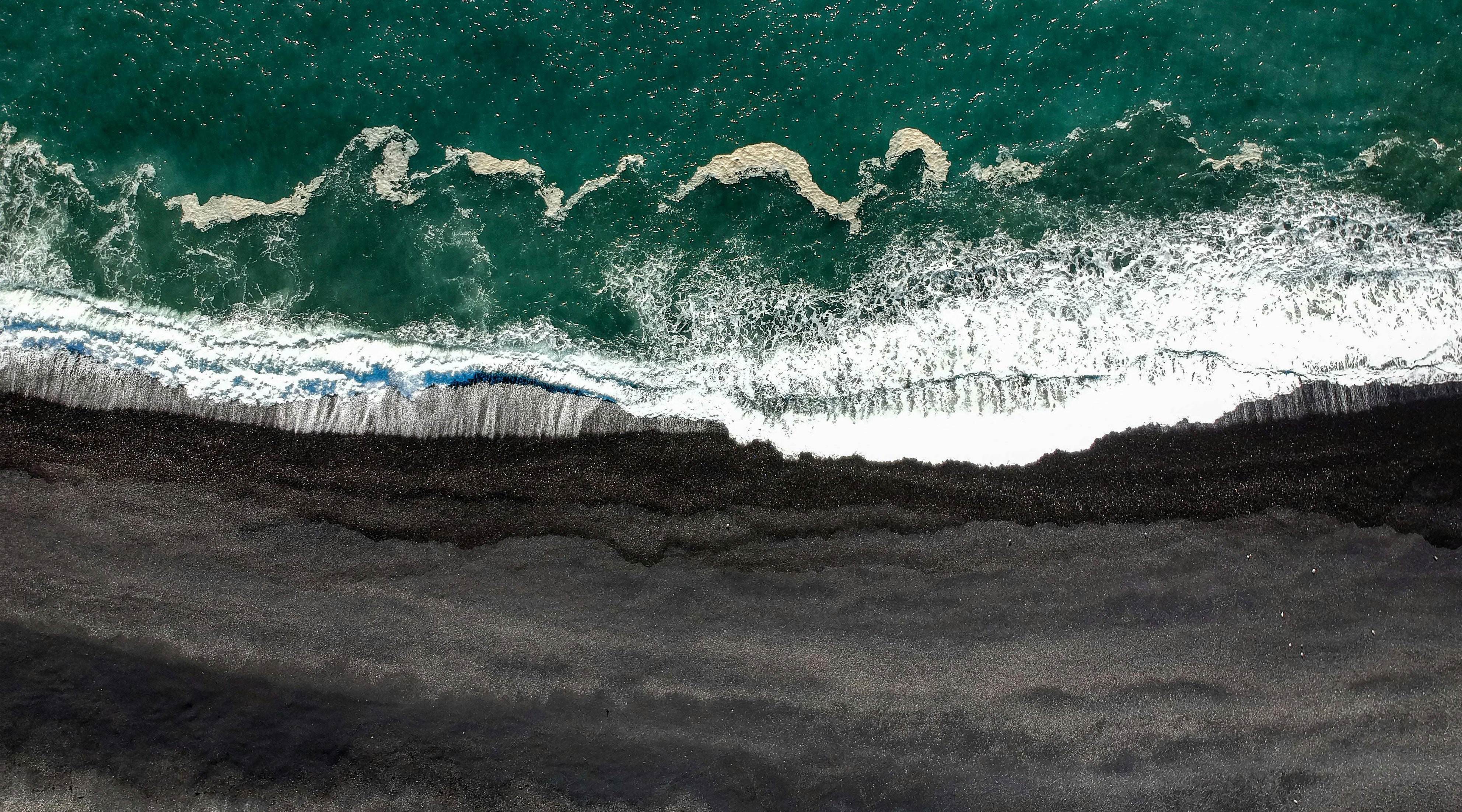 Discovering Volcanic Black: Unveiling the Mystique of Black Sand Beaches