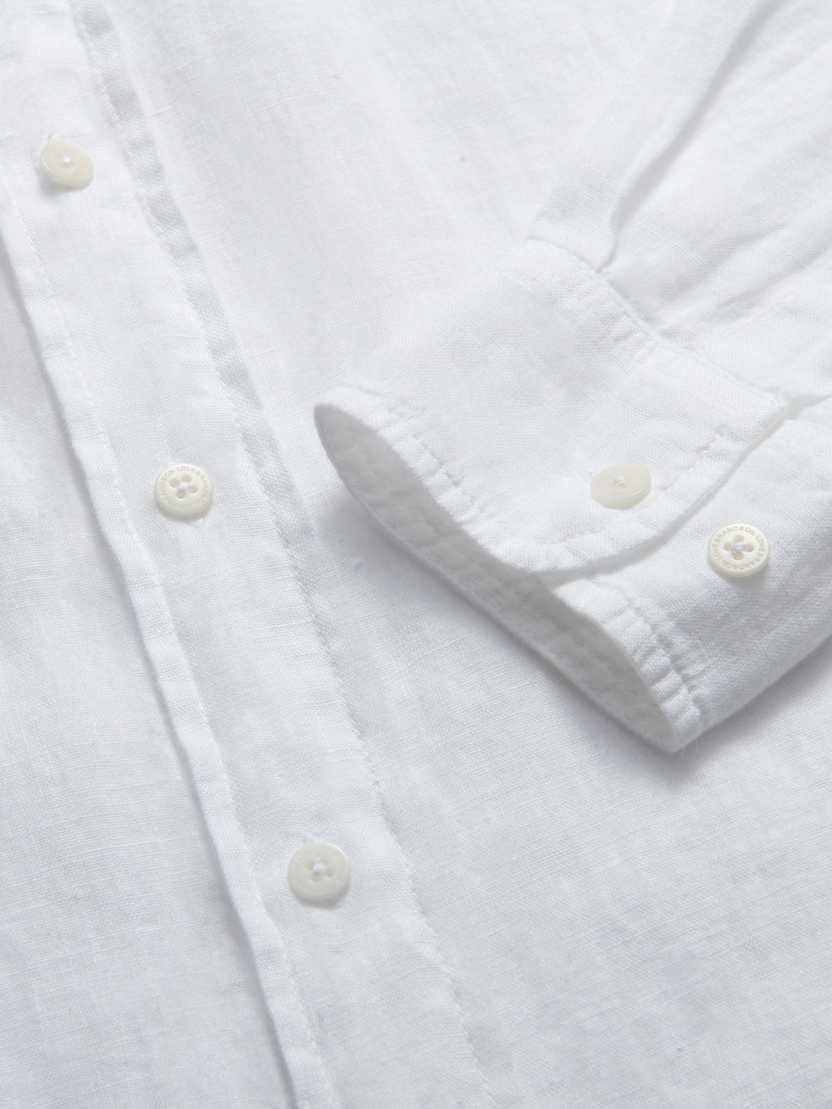 Abaco Mens White Linen Shirt detailed view of cuff.