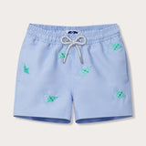 Light blue kids swim shorts with turquoise embroidered manta rays and a drawstring waistband.