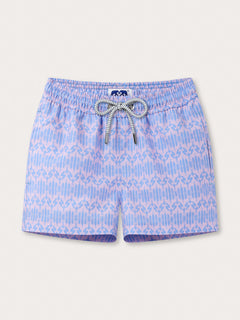 Boys Head in the Clouds Staniel Swim Shorts with pastel lavender and blue geometric giraffe pattern, featuring an elastic waistband with a drawstring tie.