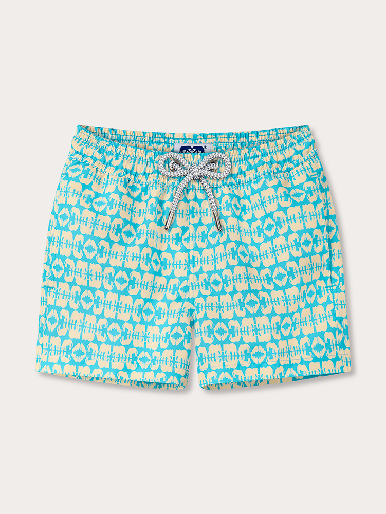 Blue and yellow kids patterned swim shorts on a white background