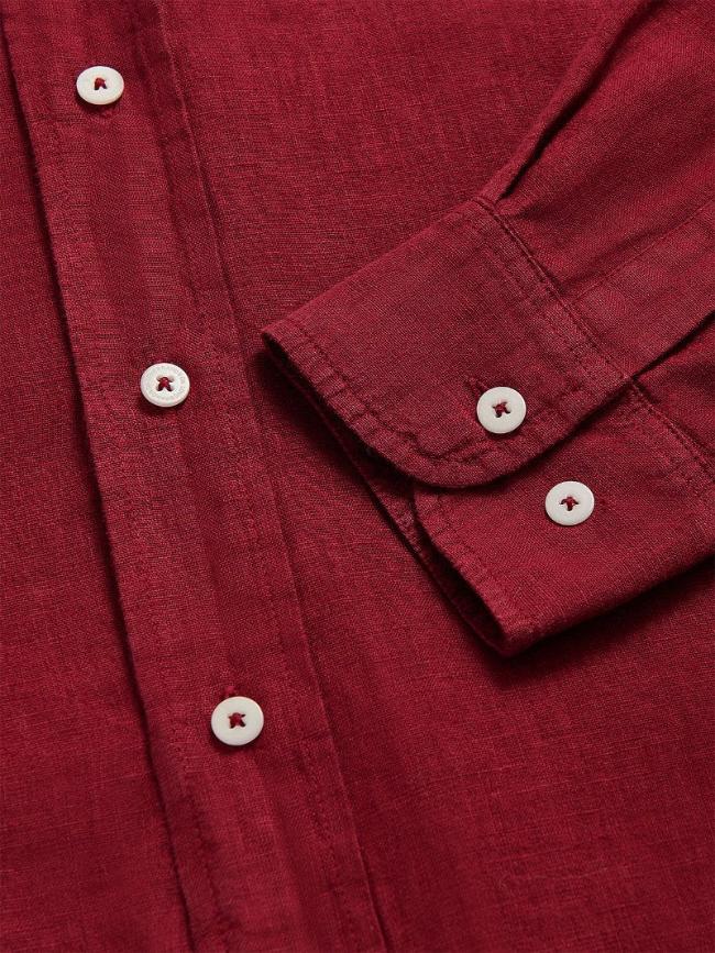 Close-up view of Men's Burgundy Abaco Linen Shirt showcasing button details and sleeve texture.