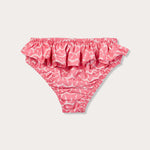 Pink Calabash baby bottoms with ruffles by Girls Fly With Me, made from recycled plastic-based materials.