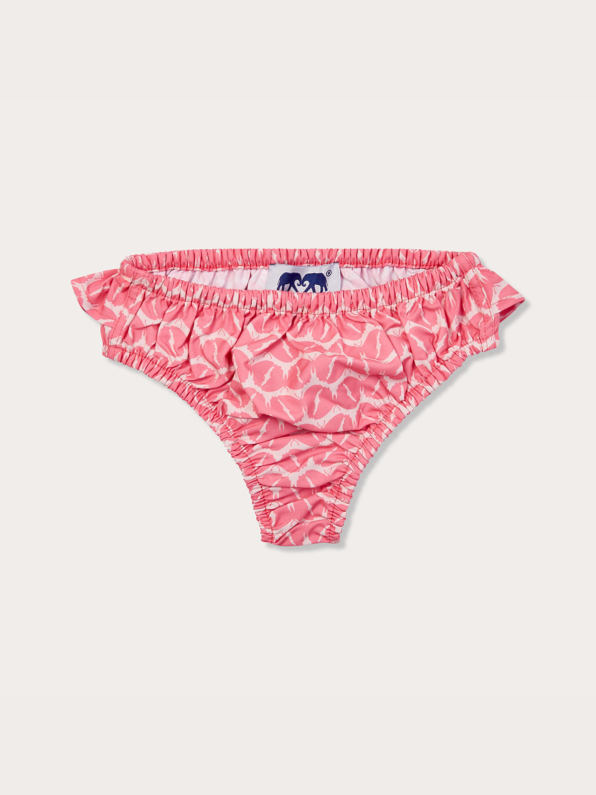 Pink and white patterned baby bottoms with ruffled sides, made from recycled plastic-based materials.