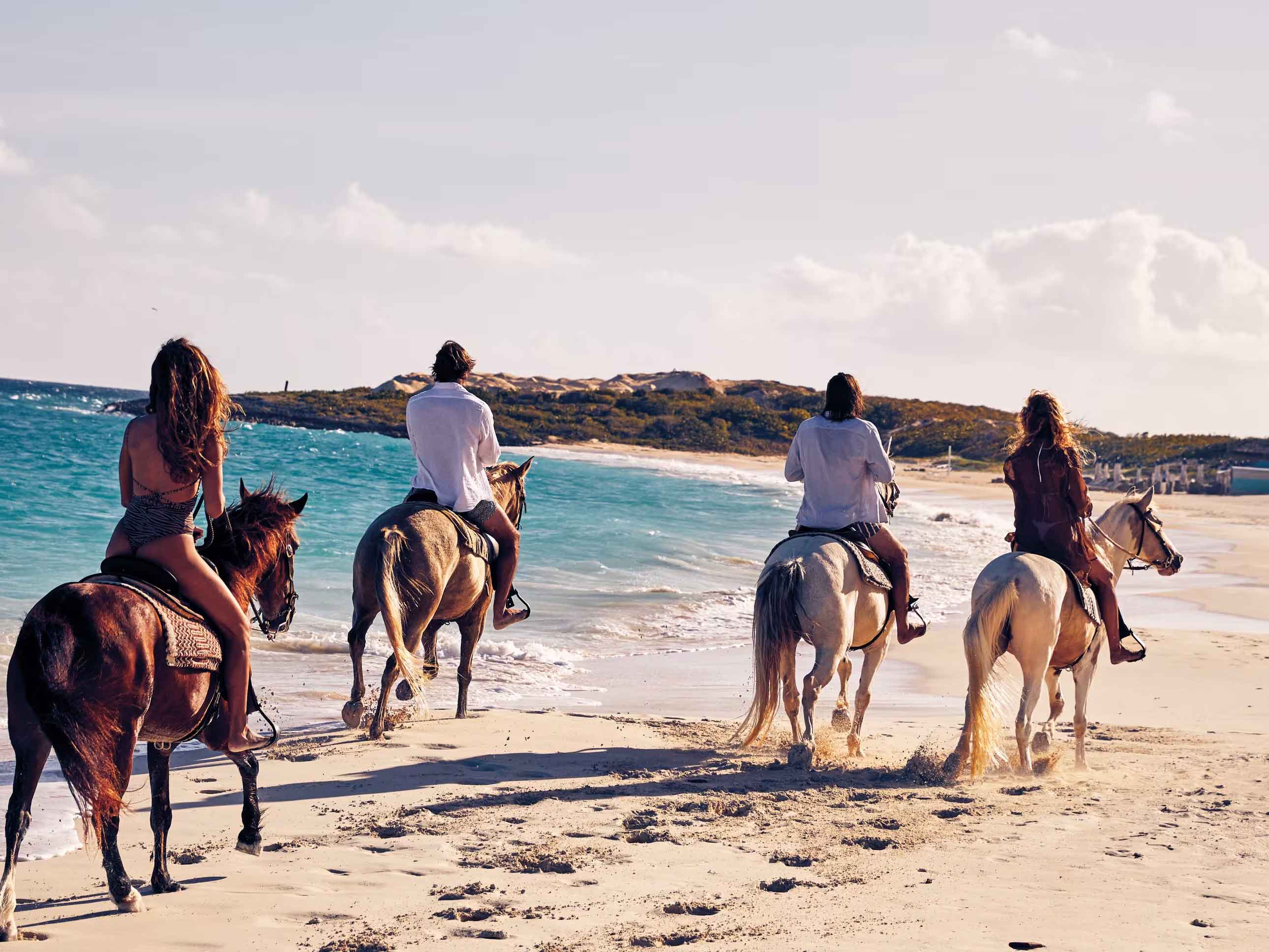 Horseback riding on the beach at Cap Juluca