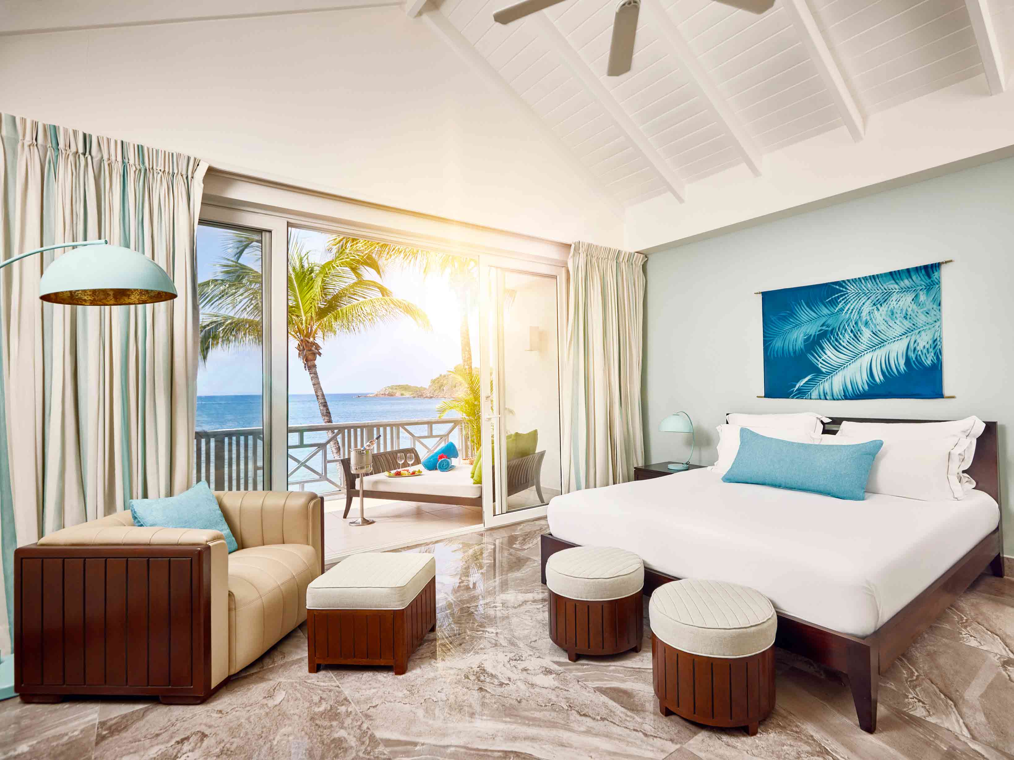 Carlisle Bay Resort accommodation. Interiror view of the Beach Balcony suite.