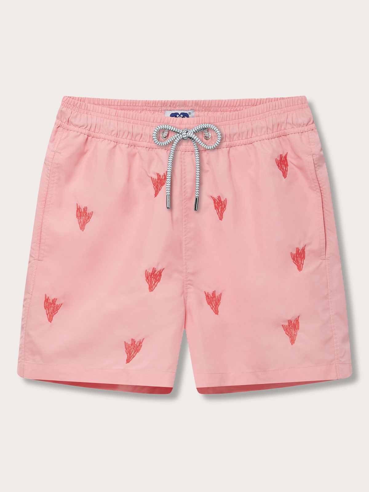 Men's Coral Colony Embroidered Staniel Swim Shorts in pastel pink with coral embroidery. Embroidered swim shorts with elastic waistband with drawstring, and quick-dry fabric made from 100% recycled polyester.