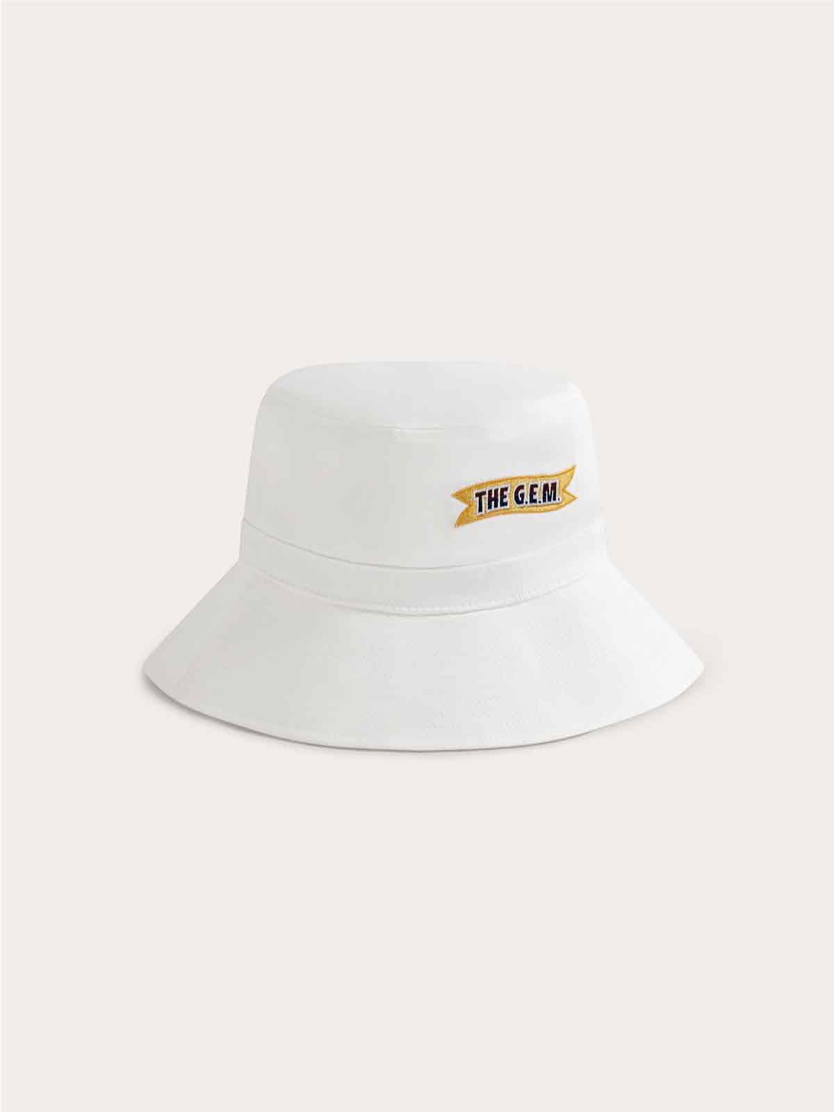 White cotton twill bucket hat with vibrant woven patches of the G.E.M. love heart logo and The G.E.M. ribbon.