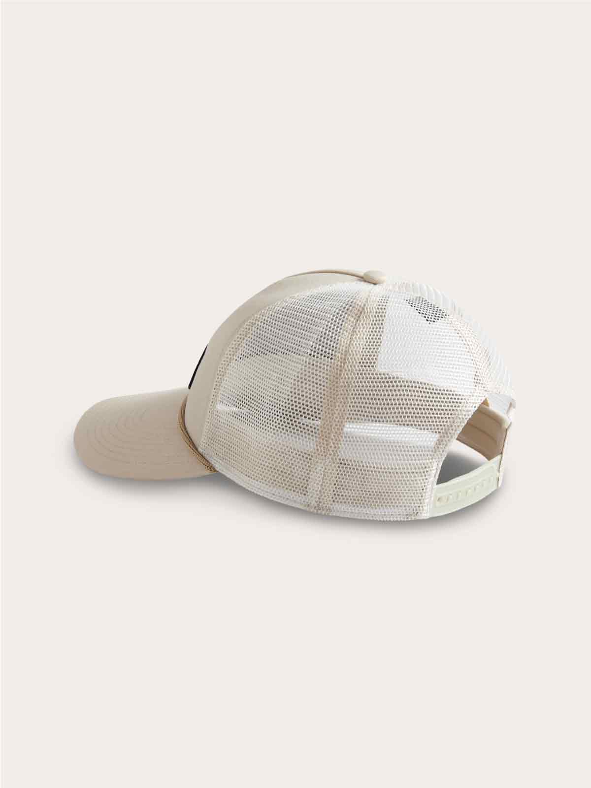 Stone-colored adjustable trucker cap with mesh back, curved visor, and "The Great Elephant Migration" logo label at the front.