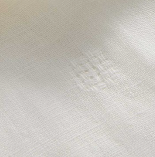 Close-up of a textured cream fabric