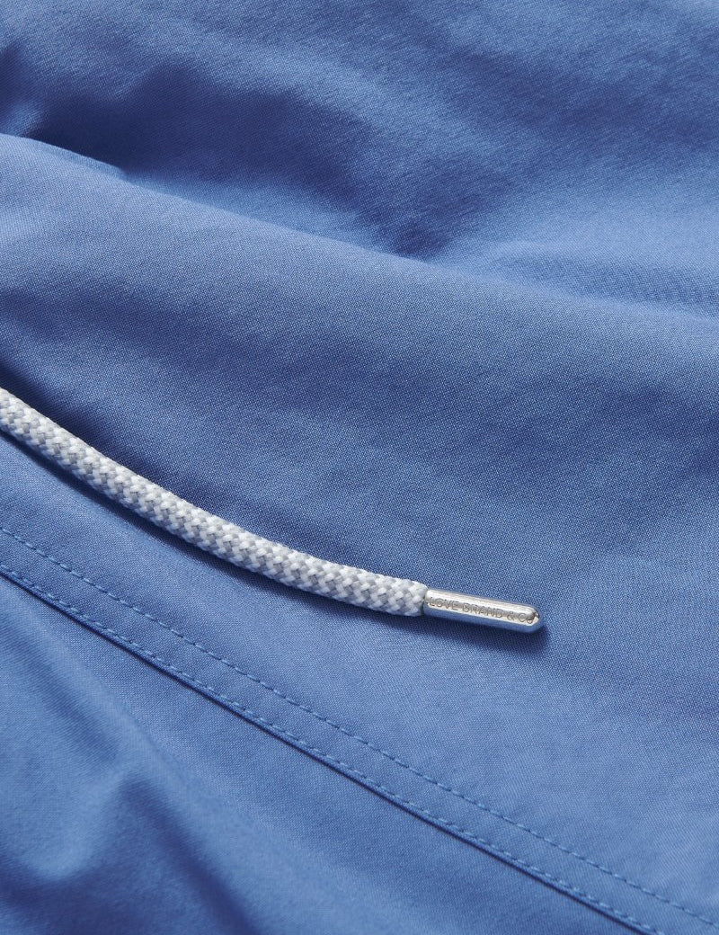 Deep Blue Staniel Swim Shorts close-up. Blue plain swim shorts featuring drawstring.