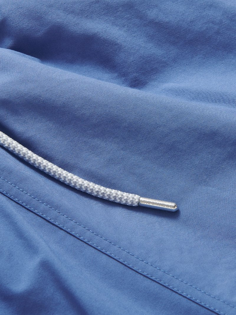 Men's Deep Blue Staniel Swim Shorts close-up. Blue plain swim shorts featuring drawstring.