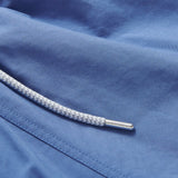 Men's Deep Blue Staniel Swim Shorts close-up. Blue plain swim shorts featuring drawstring.