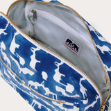 Canvas wash bag in blue featuring a block-printed pattern of Asian elephants forming the illusion of Indian palaces; shown with an open zipper displaying internal compartments and a recycled plastic lining.