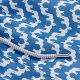 Elephant Palace Blue Staniel mens Swim Shorts detailed view. This patterned swim shorts design features white elephants raising their trunks to create a pattern that resembles Indian palaces on a blue background.