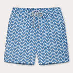 Elephant Palace Blue Staniel mens swim shorts front. Patterned swim shorts featuring white elephants raising their trunks to create a pattern that resembles Indian palaces on a blue background.