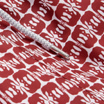 Close-up view of Men's Elephants of India Staniel Swim Shorts showing dark burgundy elephant pattern on a crisp white background with a white drawstring.