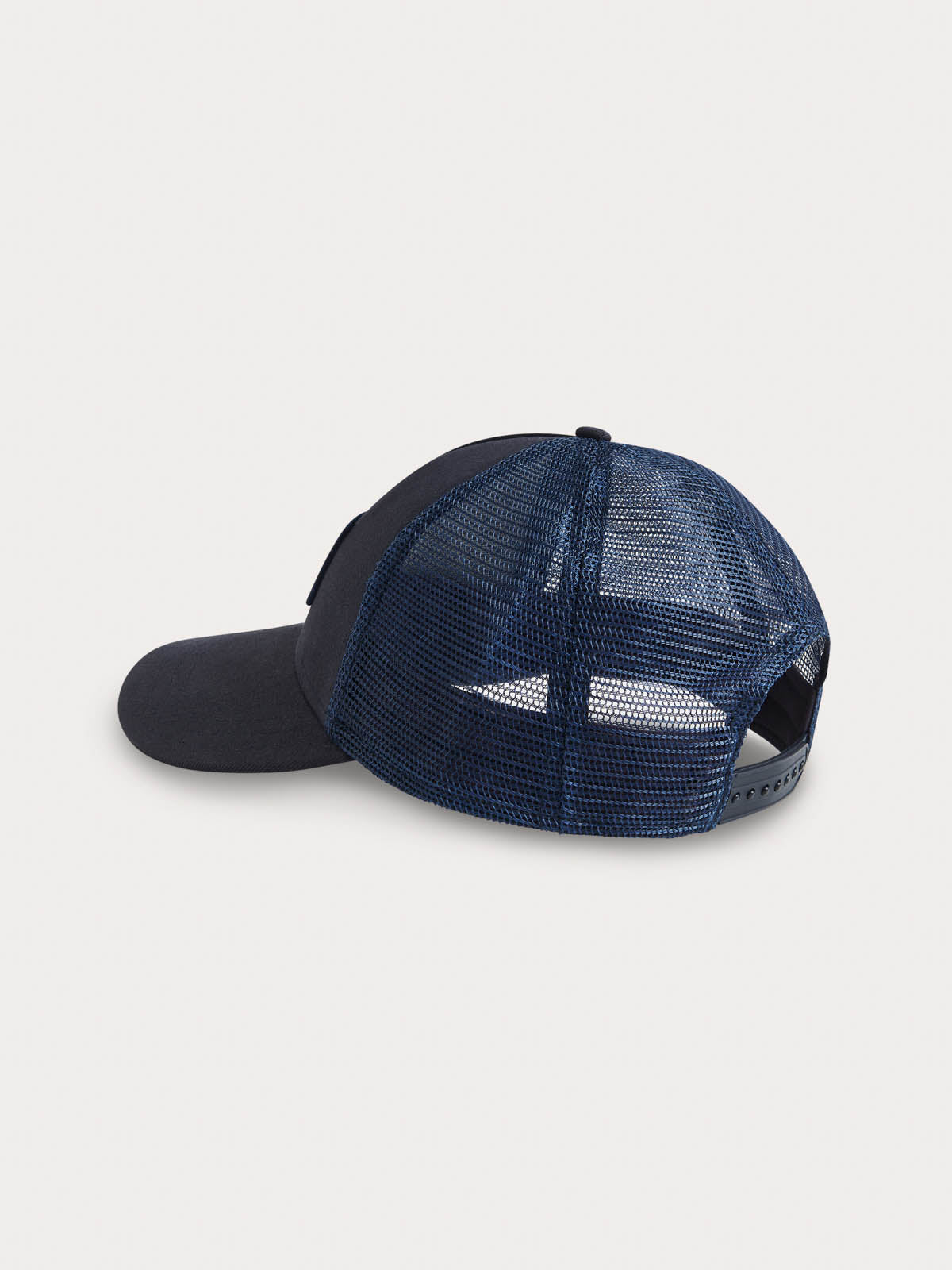 Navy Cotton Trucker Cap with navy-hued mesh back and sides, featuring structured design for shape retention.