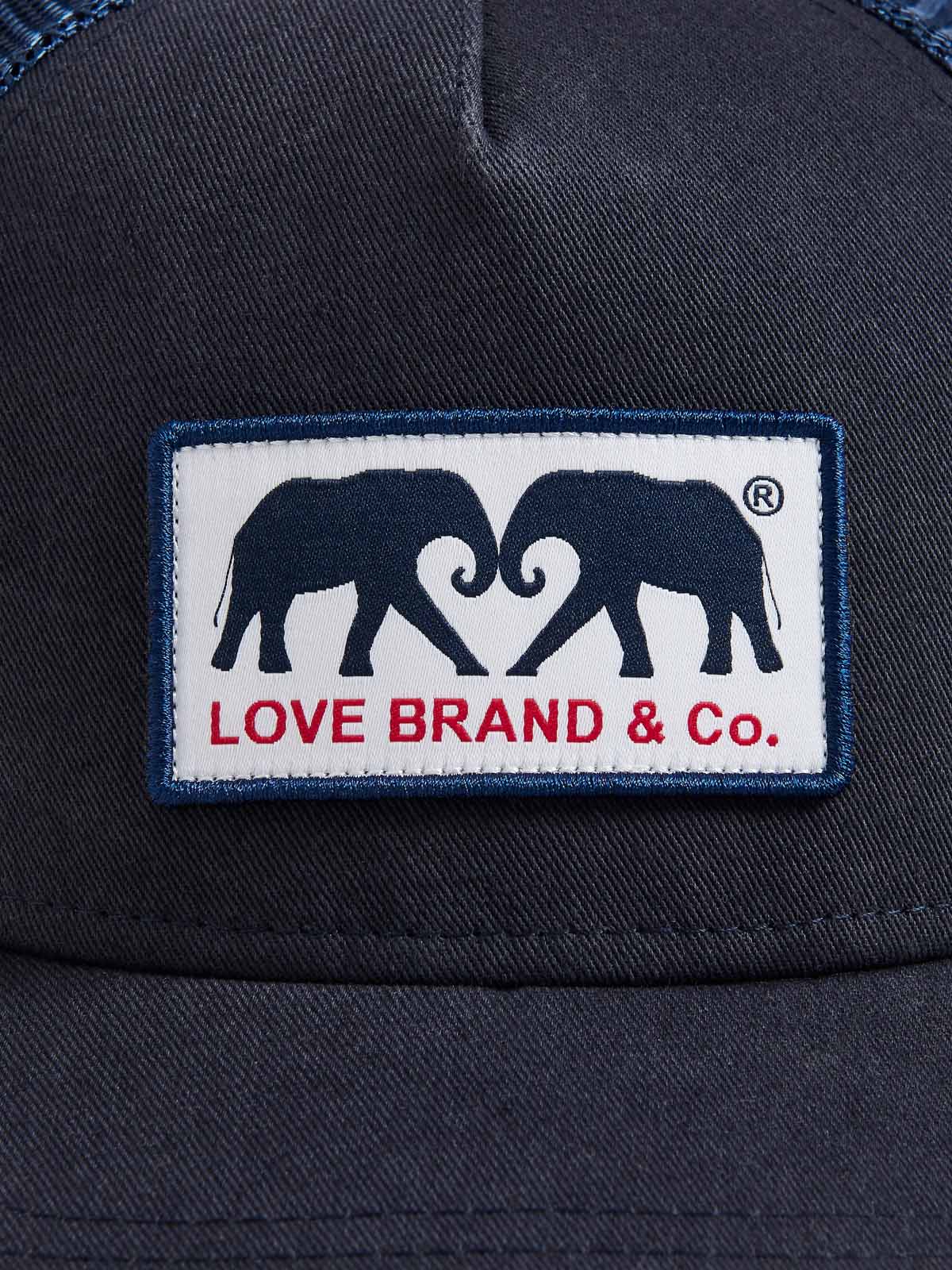 Navy Cotton Trucker Cap featuring a woven patch with LOVE BRAND & Co. elephant logo.