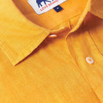 Close-up of our Golden Hour Abaco mens Linen Shirt showcasing its vibrant yellow colour and the brand label on the collar.. Old money shirts made from breathable linen fabric.