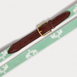 Front view of Needlepoint Belt - Elephant Palace Green. Leather belt featuring love brand elephant palace design in mint green.