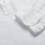 Close-up of Hoffman Mens White Linen Shirt with corozo nut buttons.