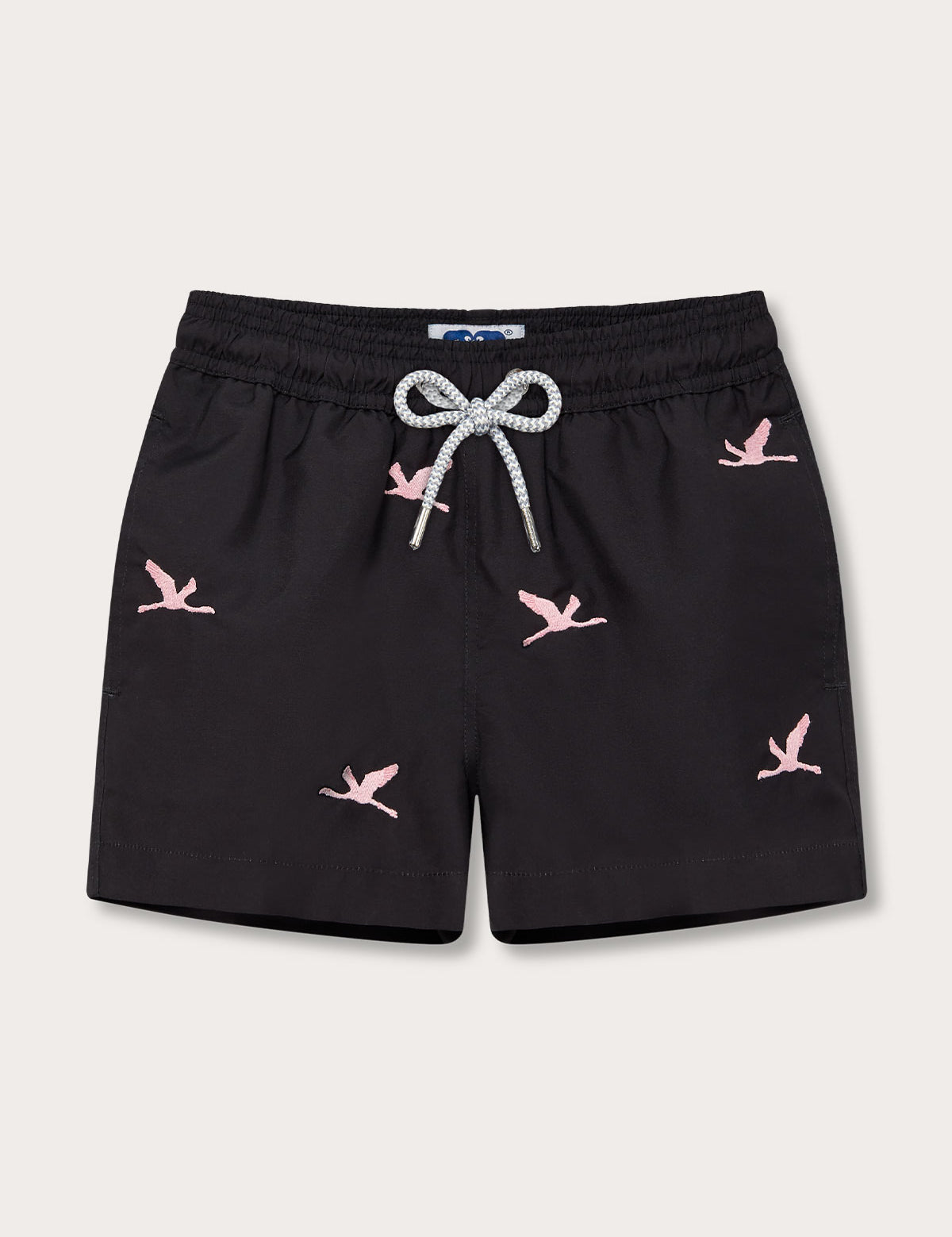 Boys Lake Nakuru Staniel Swim Shorts in black with pink flamingo patterns and drawstring waist.