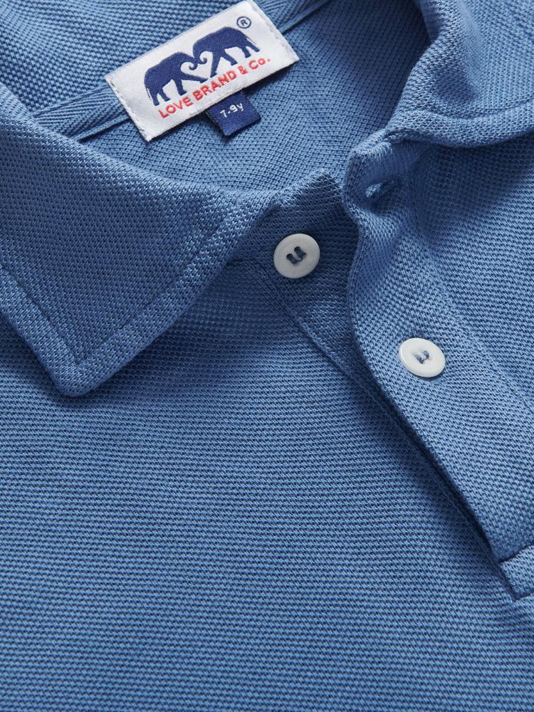 Close-up view of kids deep blue polo shirt