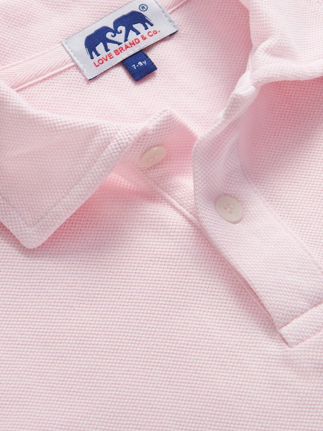 Close-up view of kids pink polo shirt