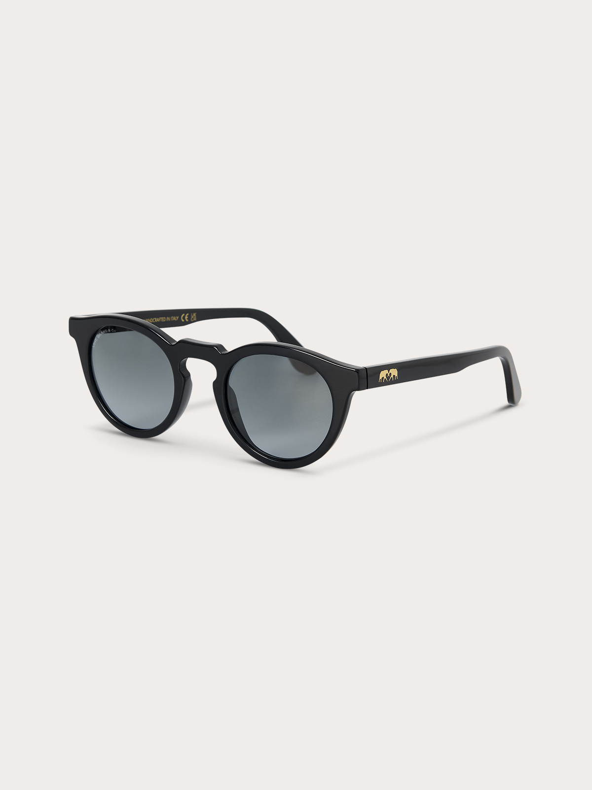 Black sunglasses with blue lenses and gold accents