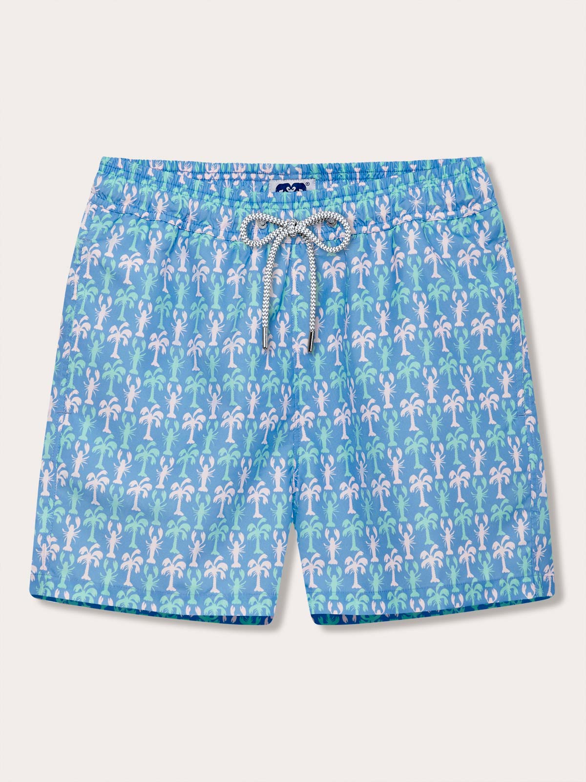 Men's patterned swim shorts featuring dancing lobsters and swaying palm trees on a blue background.