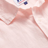 Close-up of Men's Pastel Pink Hoffman Linen Shirt showcasing the collar and fabric texture.