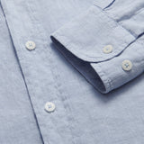 Close-up view of Men's Sky Blue Abaco Linen Shirt detailing buttons and fabric texture.