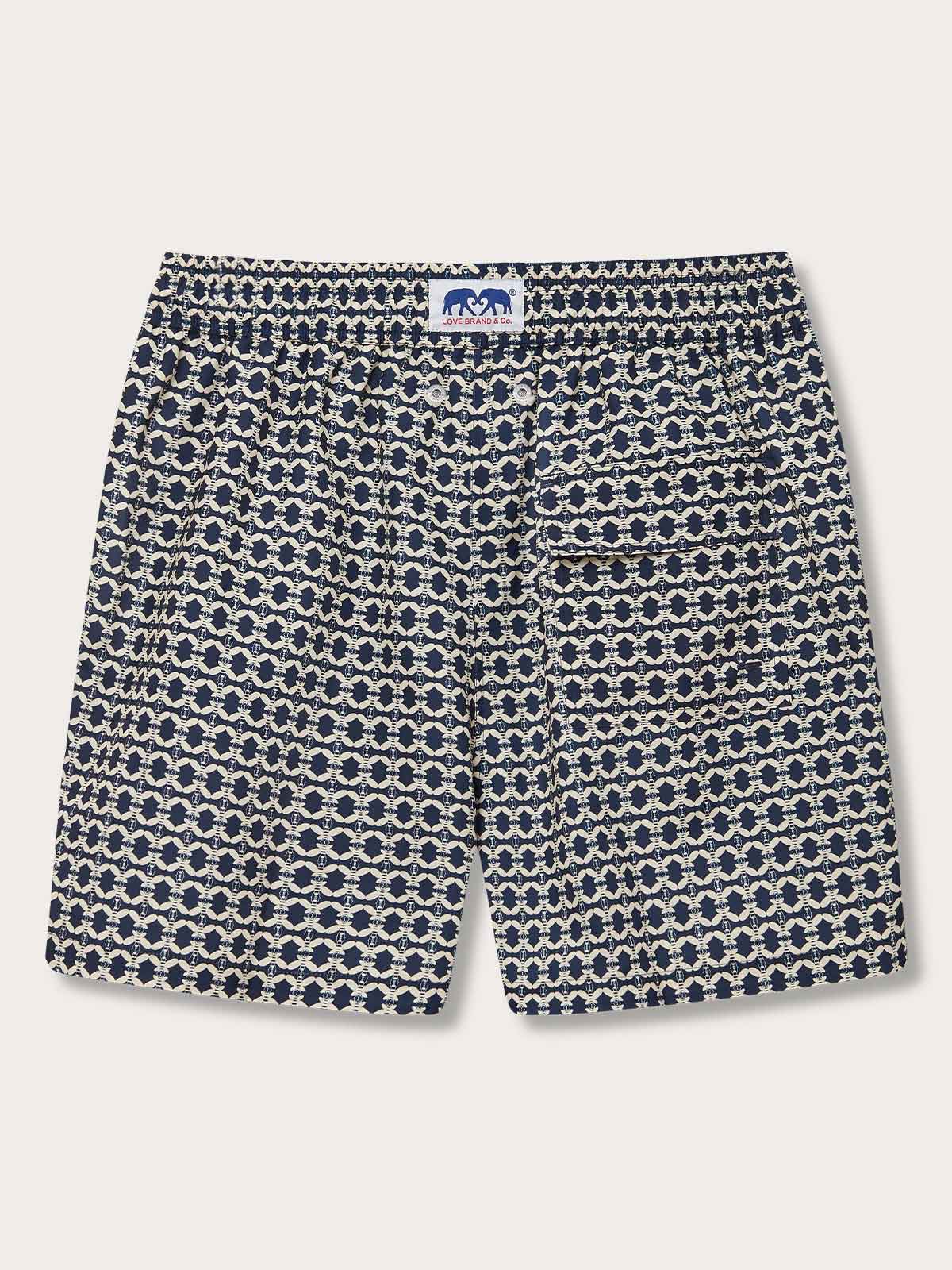 Men's Bee Propelled Staniel Swim Shorts, featuring a propeller-like stone-coloured bee pattern on a dark background.