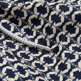 Close-up of the fabric detail on Men's Bee Propelled Staniel Swim Shorts with white bee patterns on a navy background and a grey drawstring.