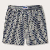 Men's Bee Propelled Staniel Swim Shorts with bee-inspired print on a deep blue base and a branded tag on the waistband, made from 100% recycled materials.