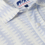 Close-up of Men's Dishy Fishy Abaco Linen Shirt featuring a chic print of a school of fish in serene blue and white hues.