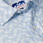 Close-up of Men's Elephant Palace Sky Abaco Linen Shirt featuring a blue and white patterned elephant and palace print.