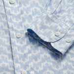 Close-up of Men's Elephant Palace Sky Abaco Linen Shirt in light blue with white elephant and palace print detailing.