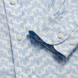 Close-up of Men's Elephant Palace Sky Abaco Linen Shirt in light blue with white elephant and palace print detailing.