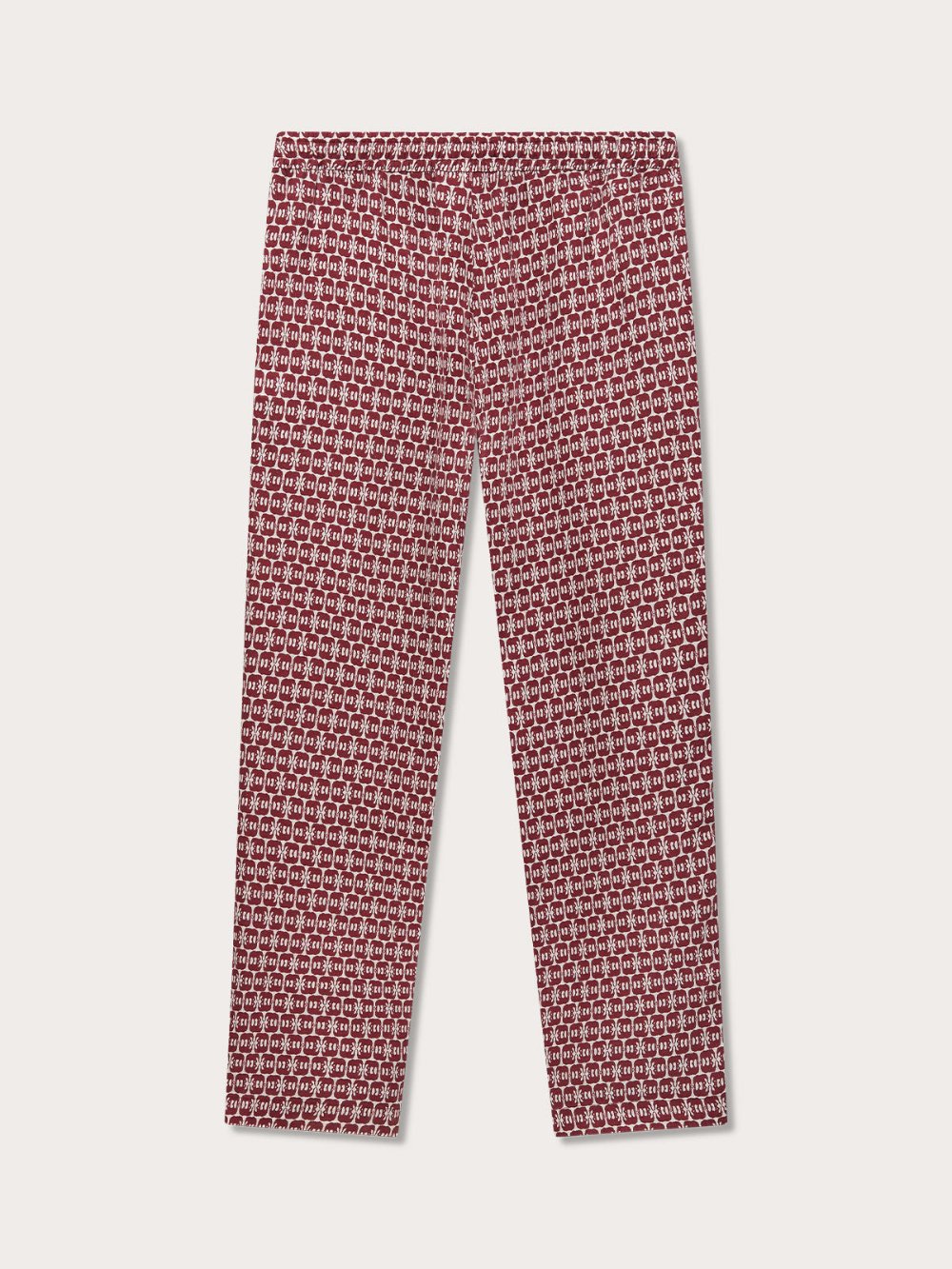 Men's Elephants of India Eleuthera Linen Trousers. Elephant trousers men featuring a red and white intricate elephant motif pattern, with drawstring waist, slightly tapered bottoms, and side pockets. Elephant clothing made from 100% linen.